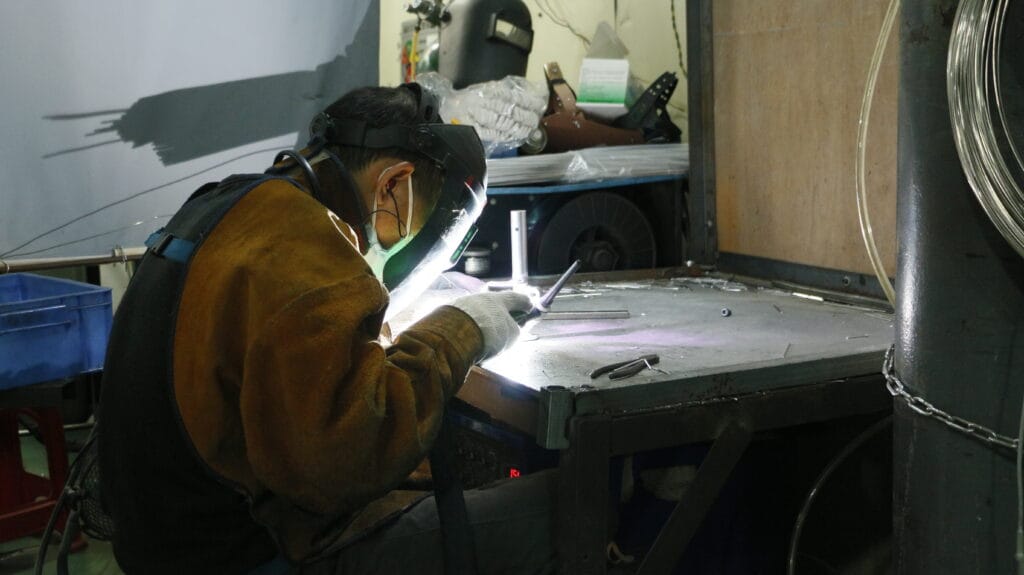 AndCare worker performing product quality inspection